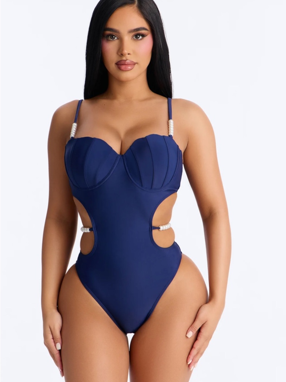Navy one piece with cutouts and pearl details